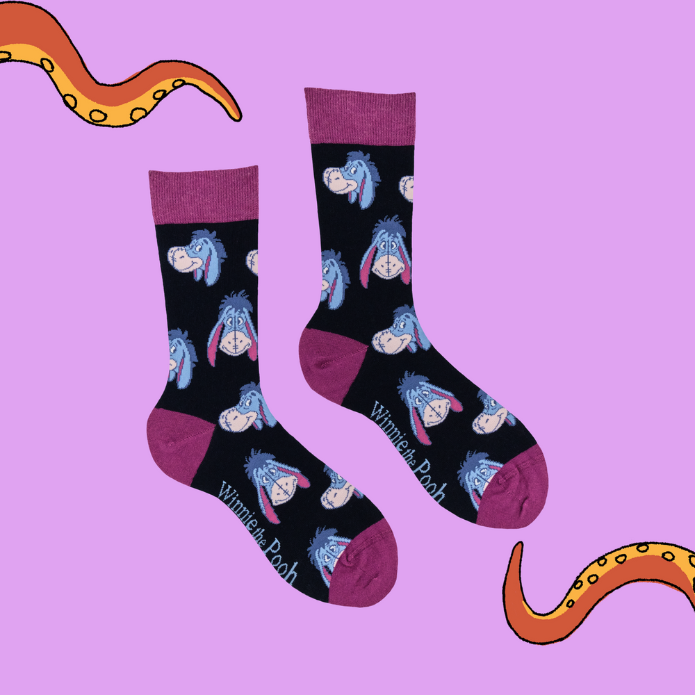 
                      
                        A pair of socks depicting eeyore. Black legs, pink heel, toe and cuff. 
                      
                    