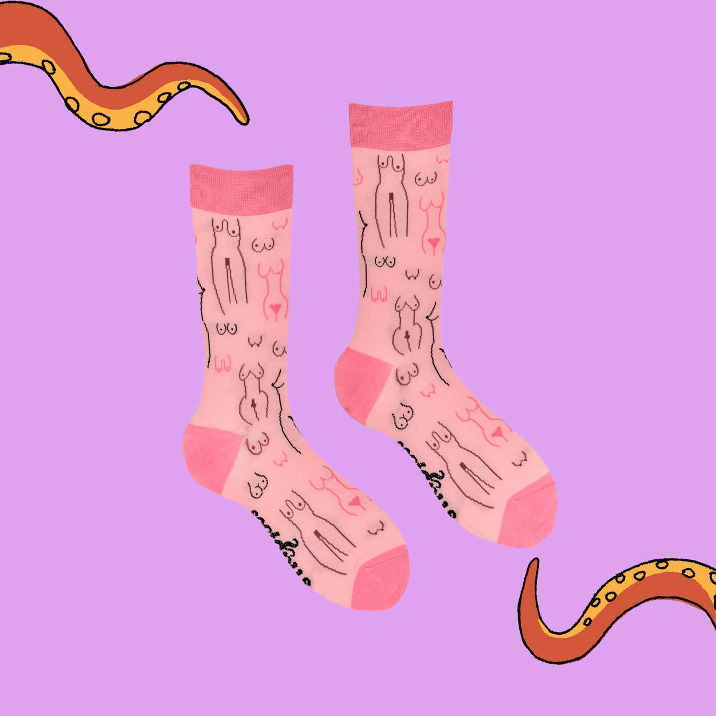 
                  
                    A pair of socks depicting tea cups and tea pots. Pink legs, dark pink cuff, heel and toe.
                  
                