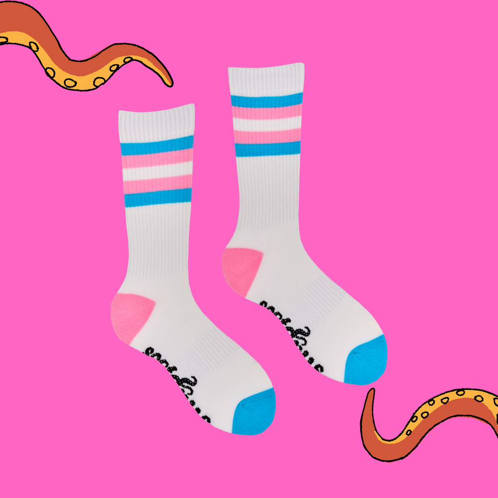 
                  
                    A pair of socks depicting tea cups and tea pots. White legs, pink and blue striped cuff, heel and toe.
                  
                