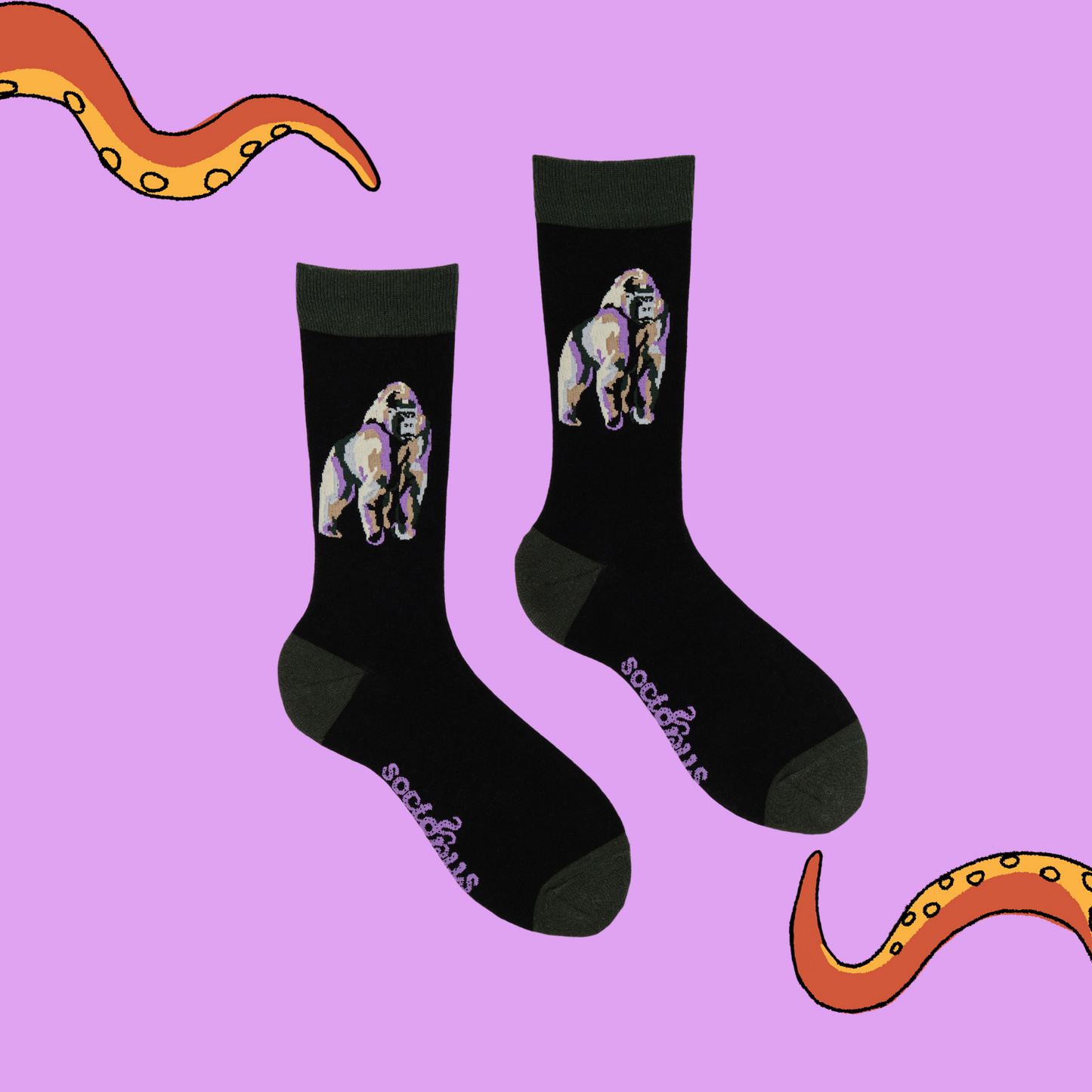 
                  
                    A pair of socks depicting a silverback gorilla. Black legs, green cuff, heel and toe.
                  
                