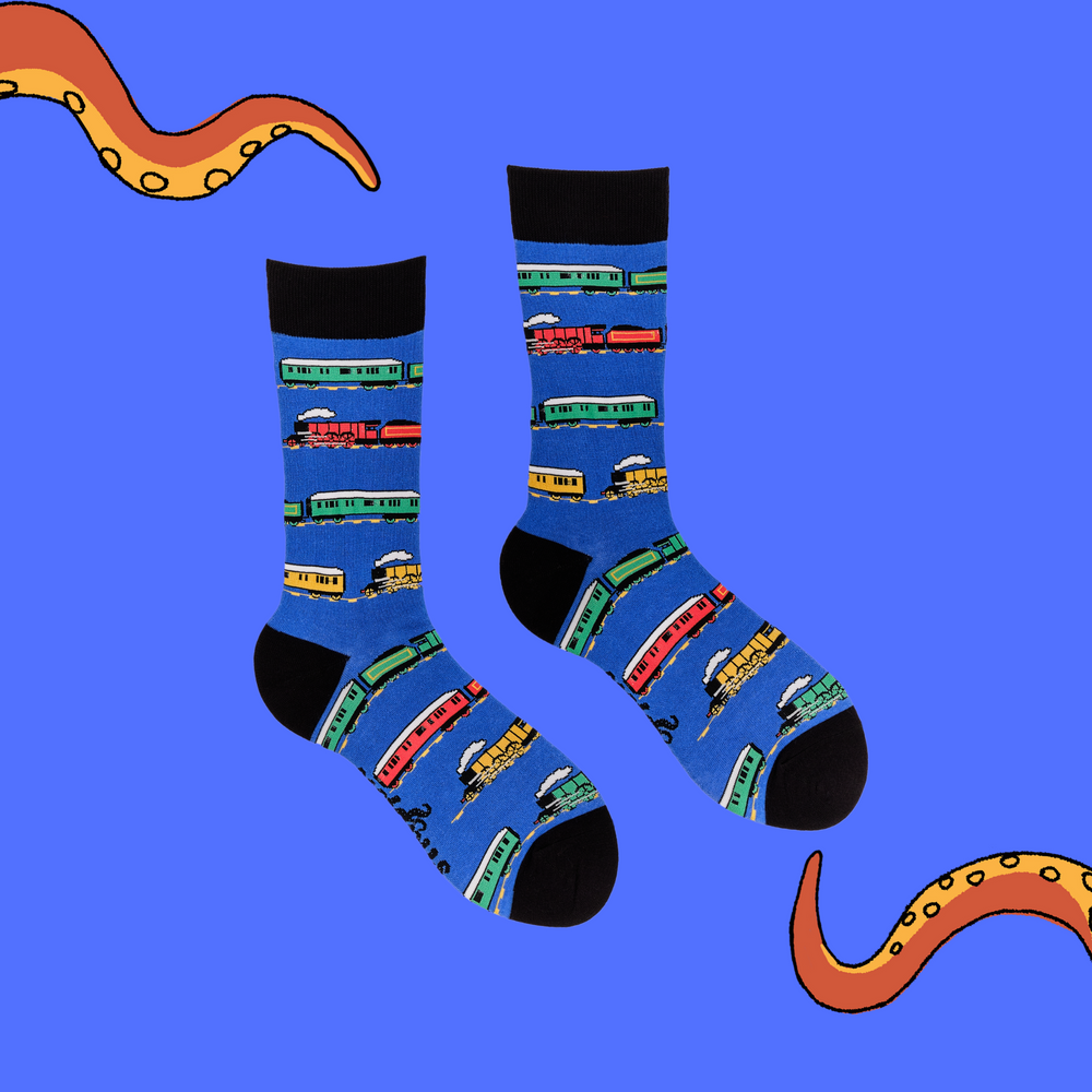
                  
                    A pair of socks depicting a variety of trains. Blue legs, black cuff, heel and toe.
                  
                