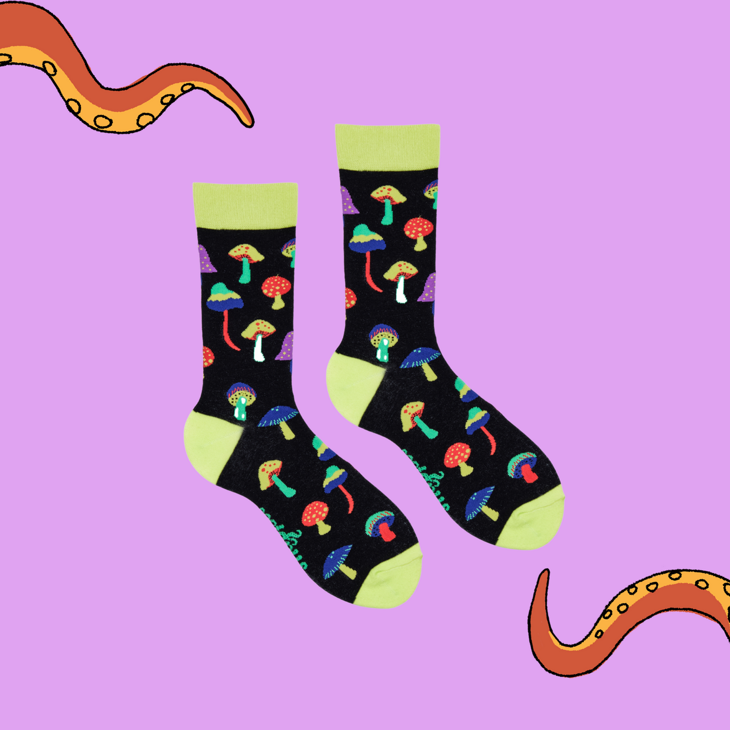 
                  
                    A pair of socks depicting magic mushrooms. Black legs, bright yellow cuff, heel and toe.
                  
                