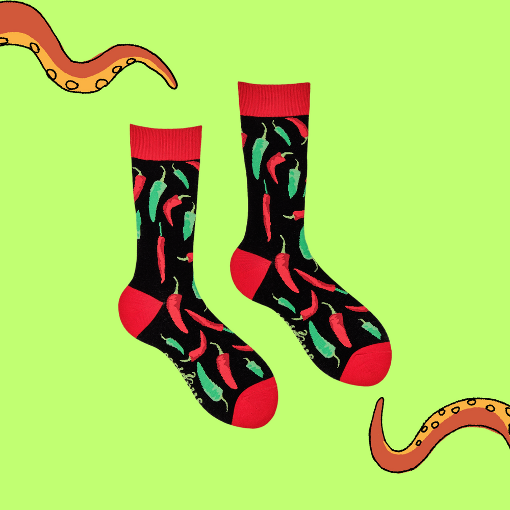 
                      
                        A pair of socks depicting red and green chilli peppers.. Black legs, red cuff, heel and toe.
                      
                    