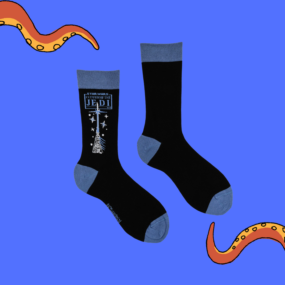 
                  
                    A pair of socks depicting hands holding a lightsaber. Black legs, blue cuff, heel and toe.
                  
                