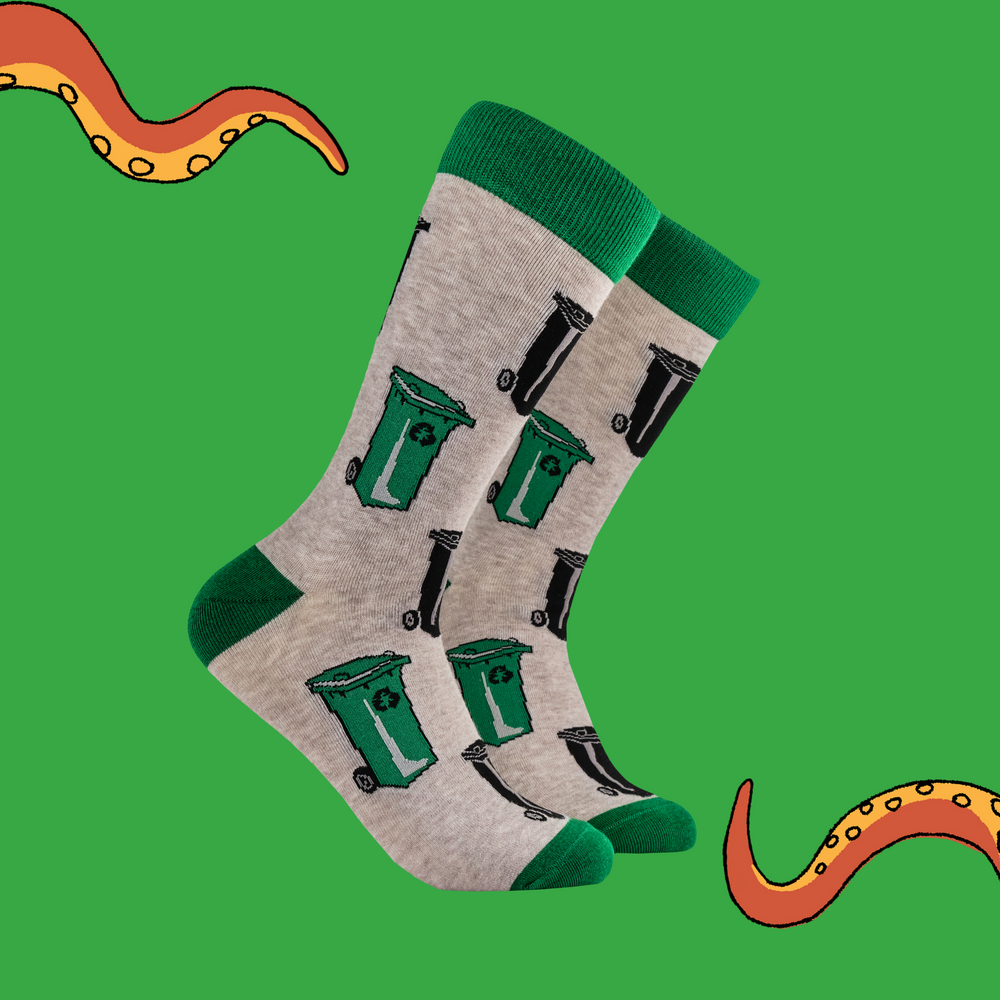 A pair of socks depicting wheelie bins. Brown legs, green toe, cuff and heel. 