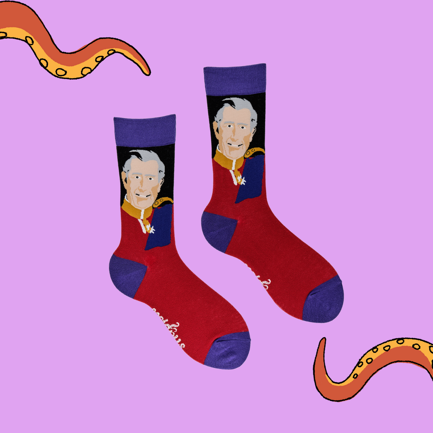 
                  
                    A pair of socks depicting King Charles III. Red legs, blue cuff, heel and toe.
                  
                