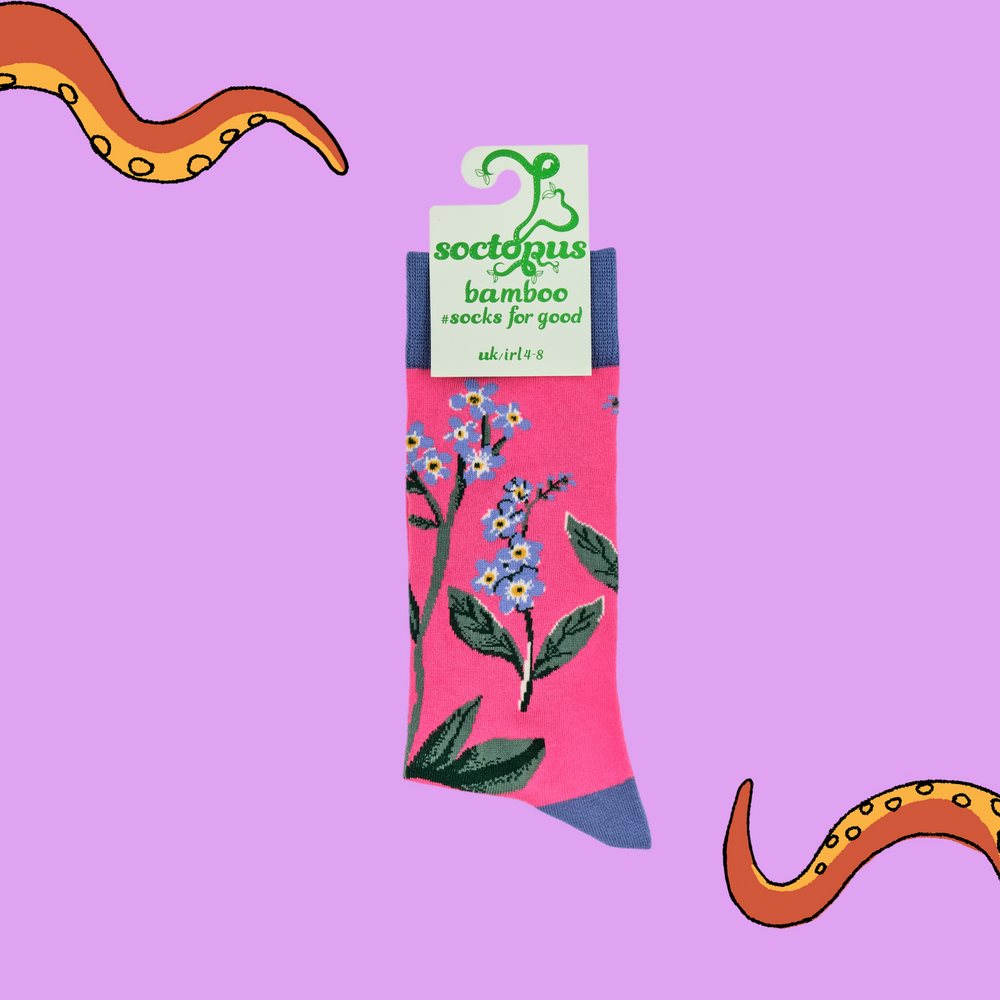 
                      
                        A pair of socks depicting forget me knot flowers. Pink legs, blue cuff, heel and toe. In Soctopus Packaging.
                      
                    