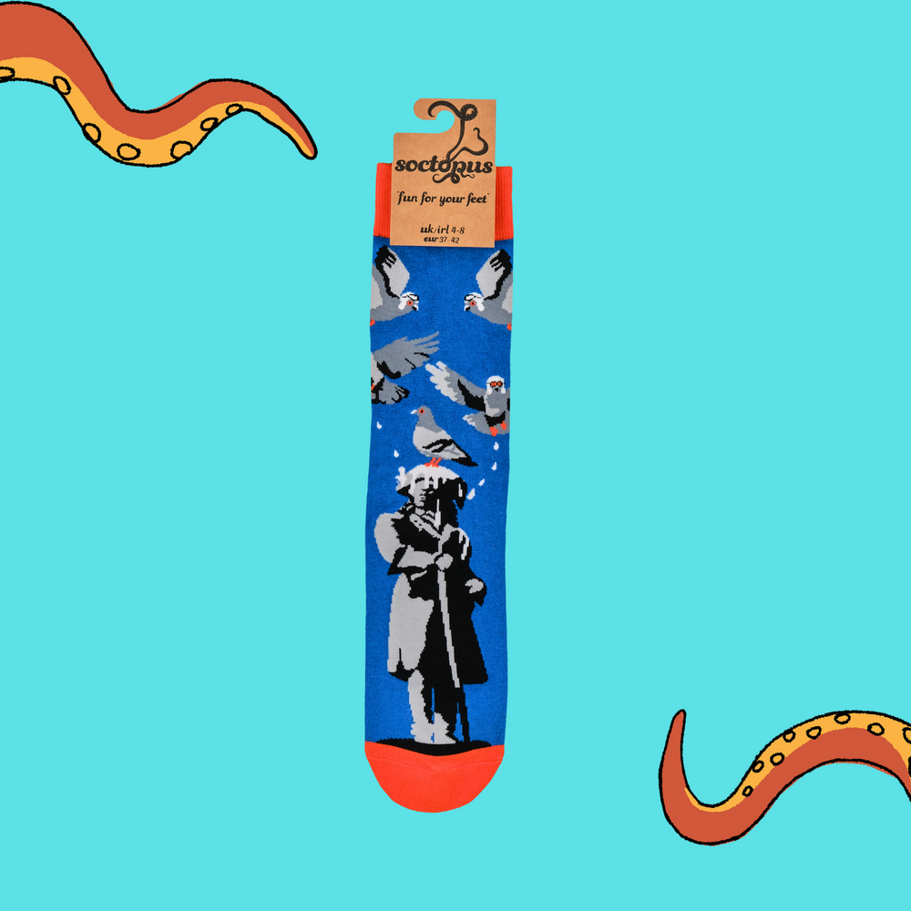 
                      
                        A pair of socks depicting pigeons pooping on a statue. Blue legs, orange heel, toe and cuff. 
                      
                    