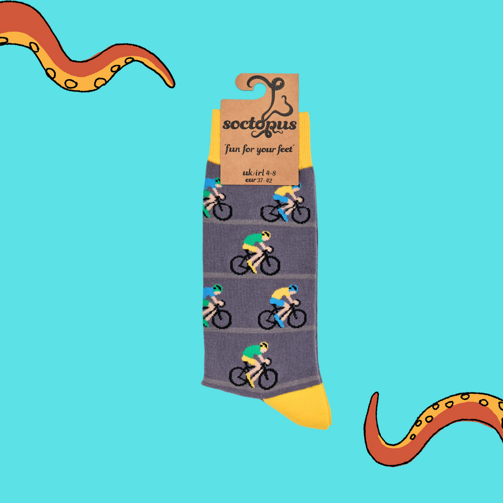 
                      
                        A pair of socks depicting racing cycles. Grey legs, yellow cuff, heel and toe. In Soctopus Packaging.
                      
                    