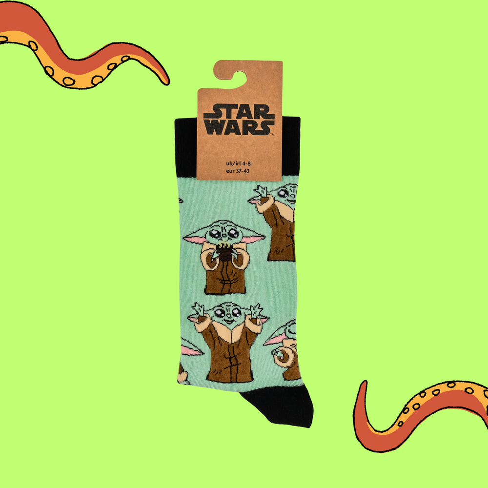 
                      
                        A pair of socks depicting Grogu from Star Wars. Green legs, black toe, heel and cuff. 
                      
                    