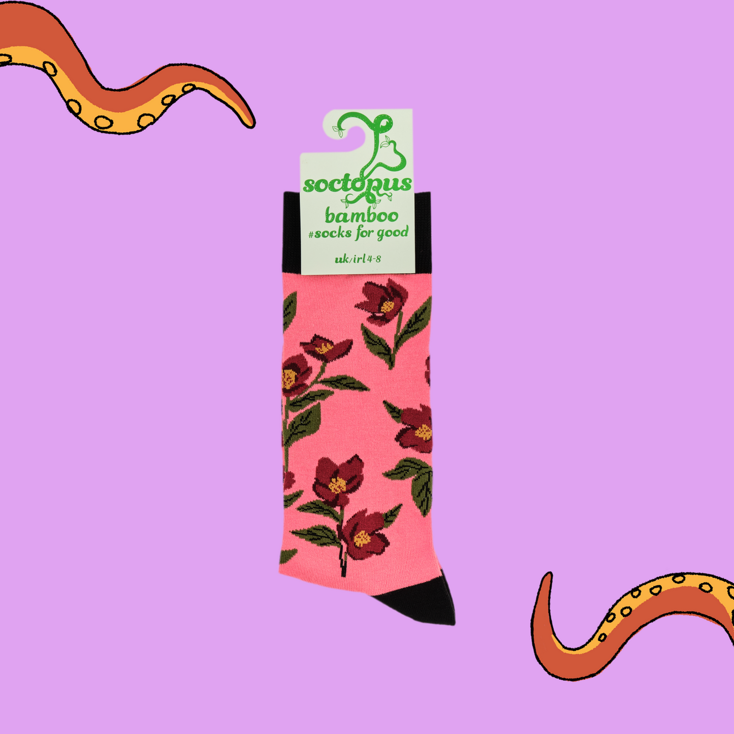 
                  
                    A pair of socks depicting hellebores. Pink legs, black cuff, heel and toe. In Soctopus Packaging.
                  
                