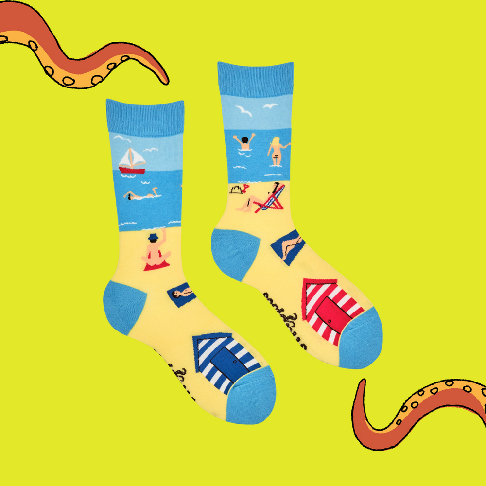 
                      
                        A pair of socks with a fun beach design. Blue heel, toe and cuff. 
                      
                    