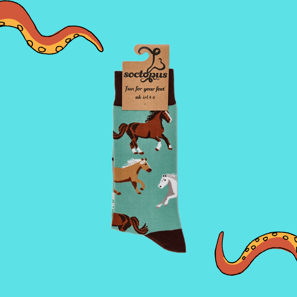 
                      
                        A pair of socks depicting horses. Turquoise legs, brown cuff, heel and toe. In Soctopus Packaging.
                      
                    