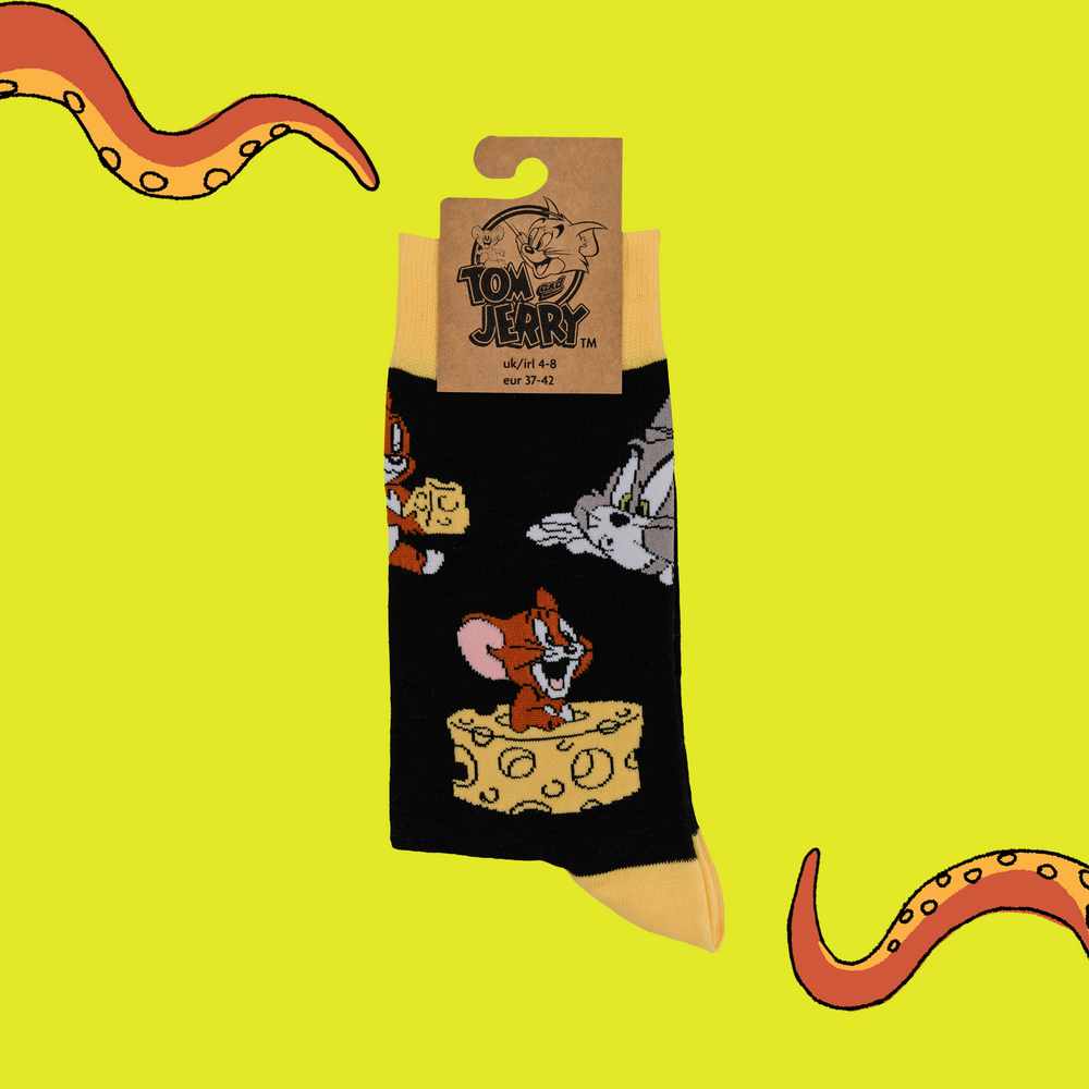 
                      
                        A pair of socks depicting the lovable duo of Tom and Jerry. Black legs, yellow toe, cuff and heel.
                      
                    