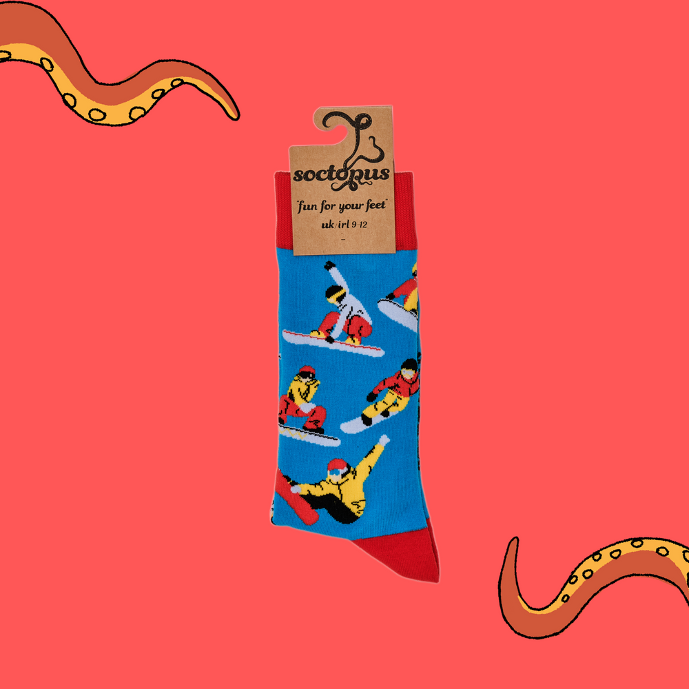 
                  
                    A pair of socks depicting snowboarders. Blue legs, red cuff, heel and toe. In Soctopus Packaging.
                  
                