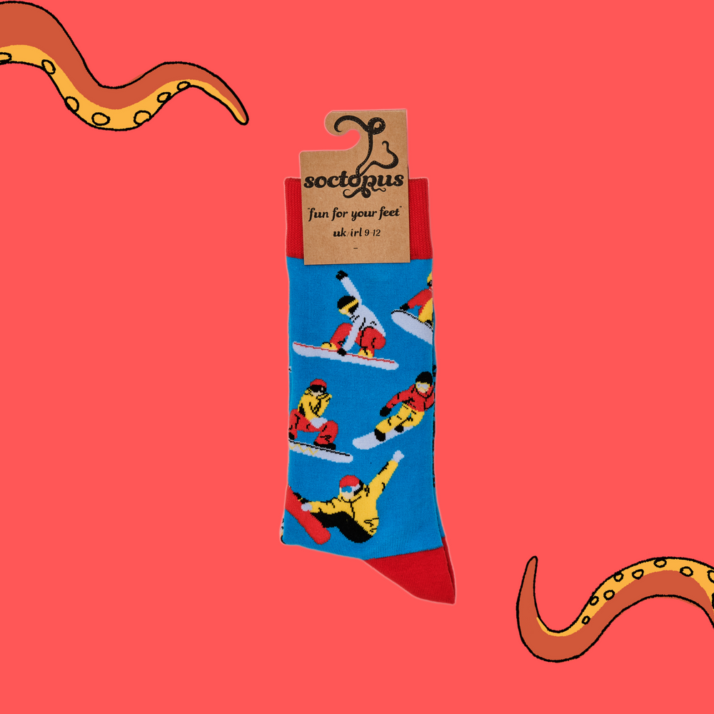 
                      
                        A pair of socks depicting snowboarders. Blue legs, red cuff, heel and toe. In Soctopus Packaging.
                      
                    