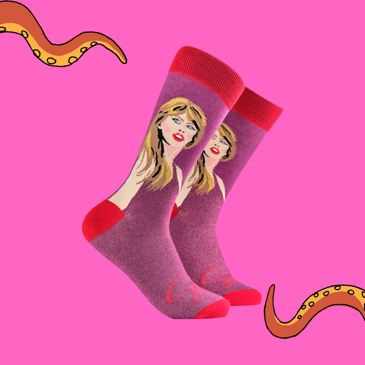 A pair of socks featuring Taylor Swift. Pink glittery legs, red heel toe and cuff. 