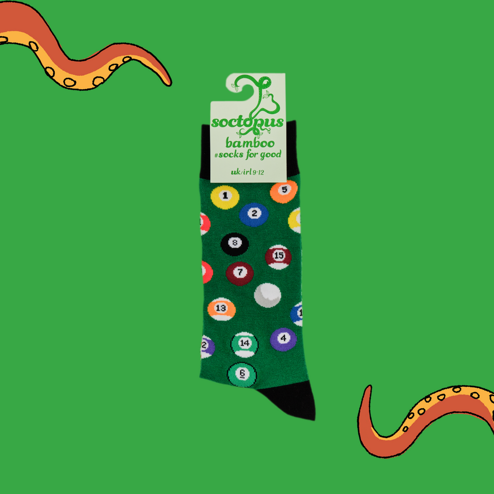 
                      
                        A pair of socks depicting pool balls. Green legs, black cuff, heel and toe. In Soctopus Packaging.
                      
                    