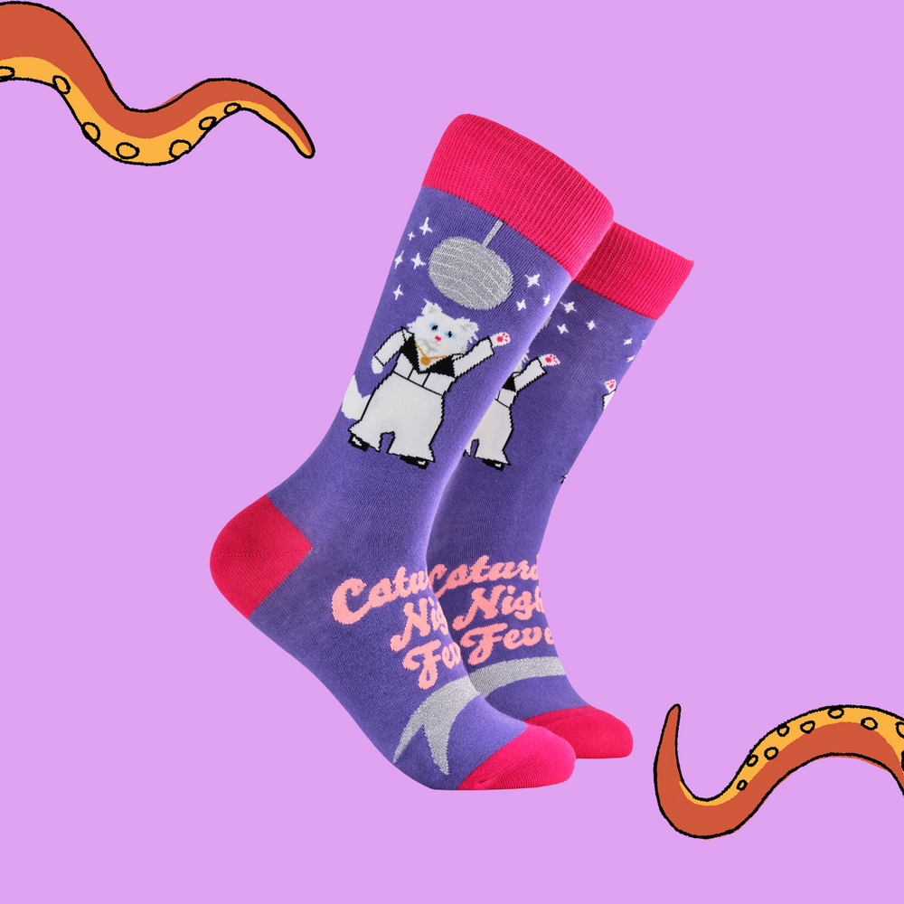 A pair of socks featuring a 70s disco cat. Purple legs, bright pink heel, toe and cuff. 