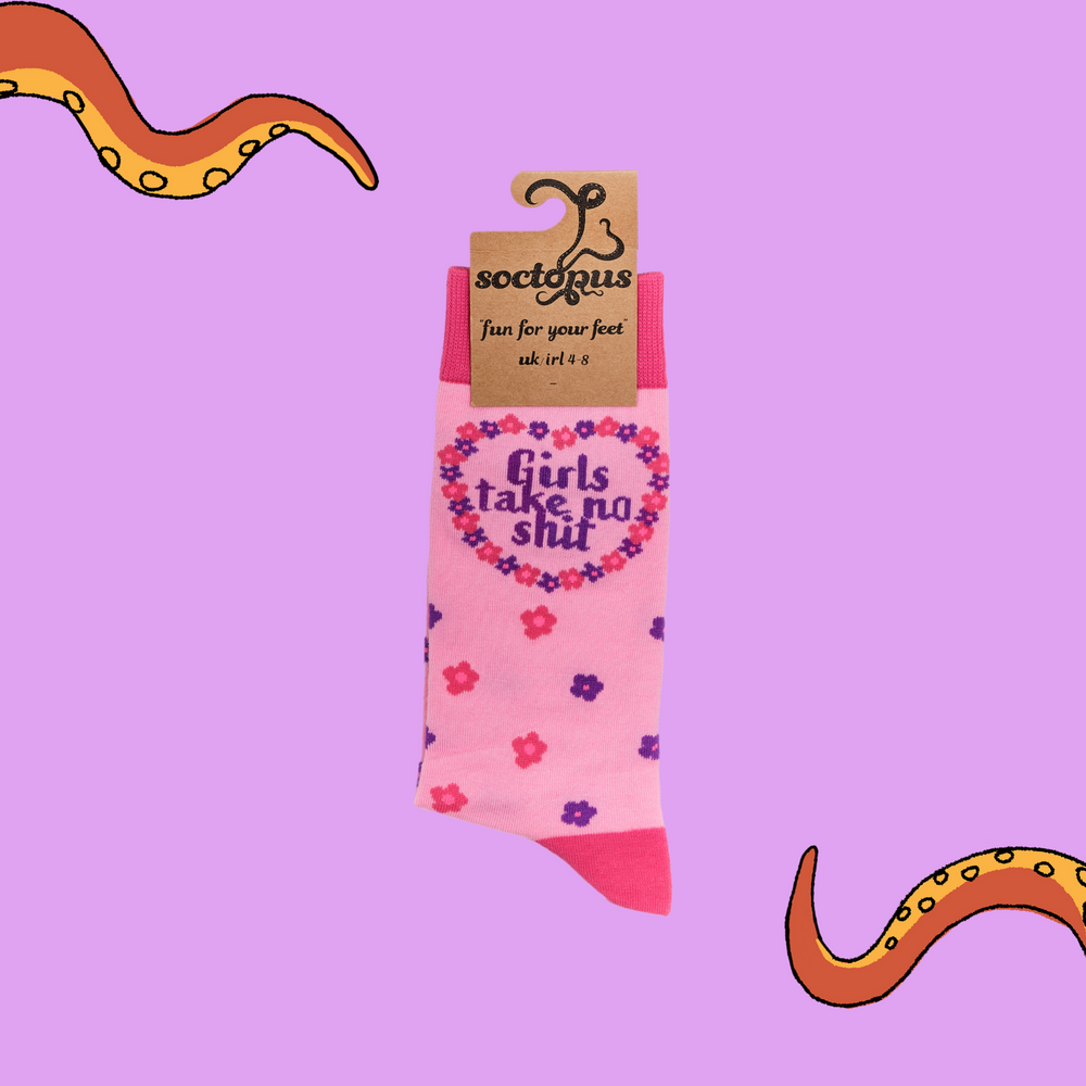 
                  
                    A pair of socks depicting the words "Girls Tale No Shit". Pink legs, dark pink cuff, heel and toe. In Soctopus Packaging. 
                  
                