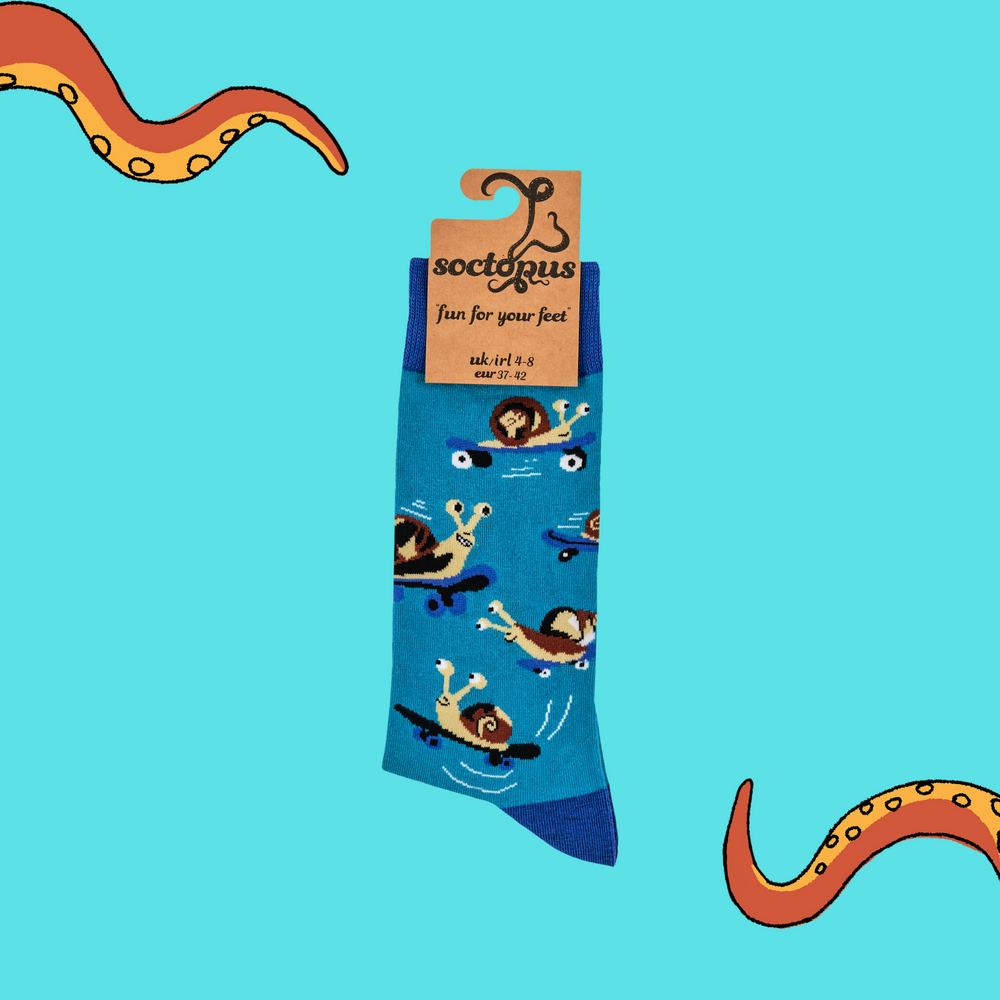 
                      
                        A pair of socks depicting a snail on a skateboard. Blue legs, light blue heel, toe and cuff. 
                      
                    