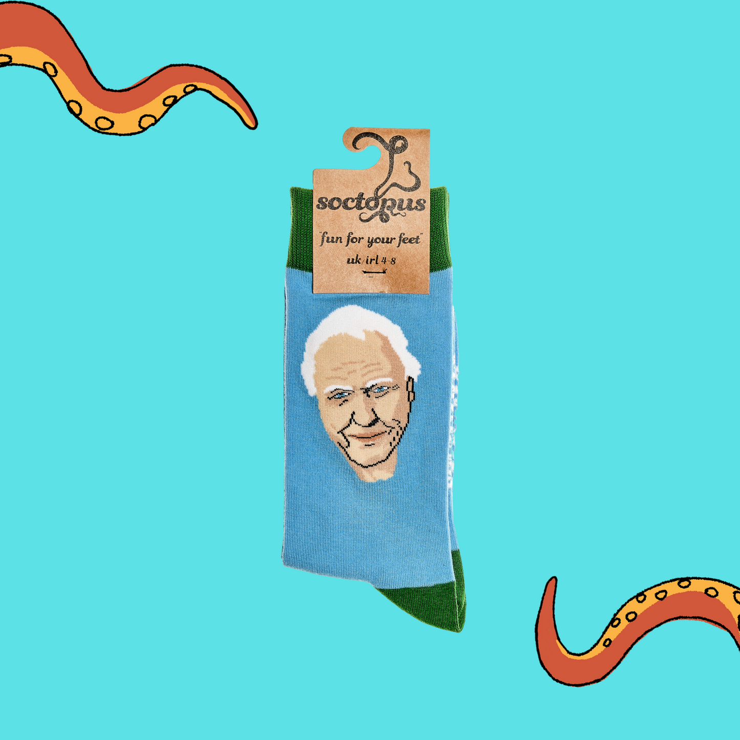 
                  
                    A pair of socks depicting Sir David Attenborough Socks. Blue legs, green cuff, heel and toe. In Soctopus Packaging.
                  
                