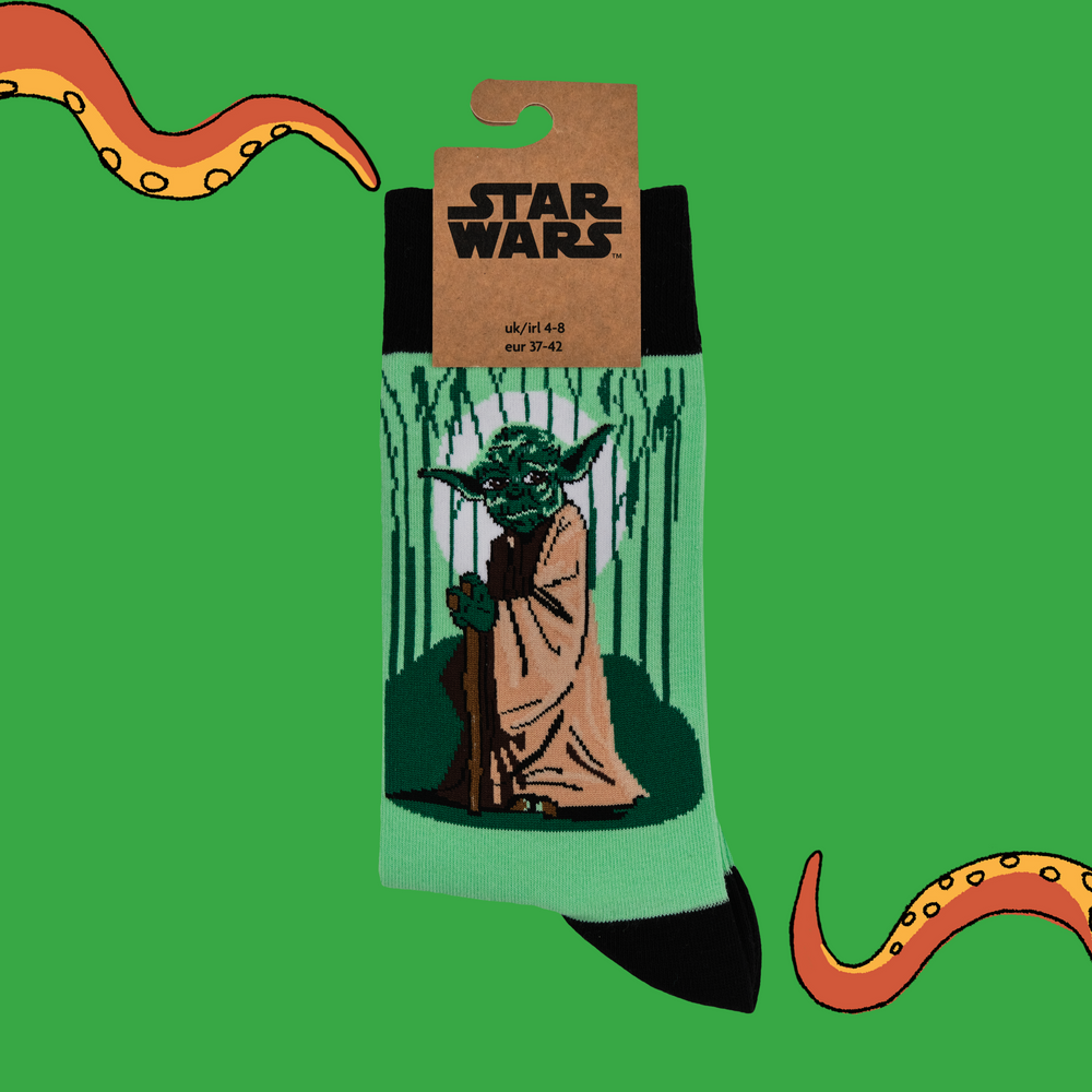 
                      
                        A pair of socks depicting Master Yoda. Green legs. Dark green cuff, toe and heel.
                      
                    