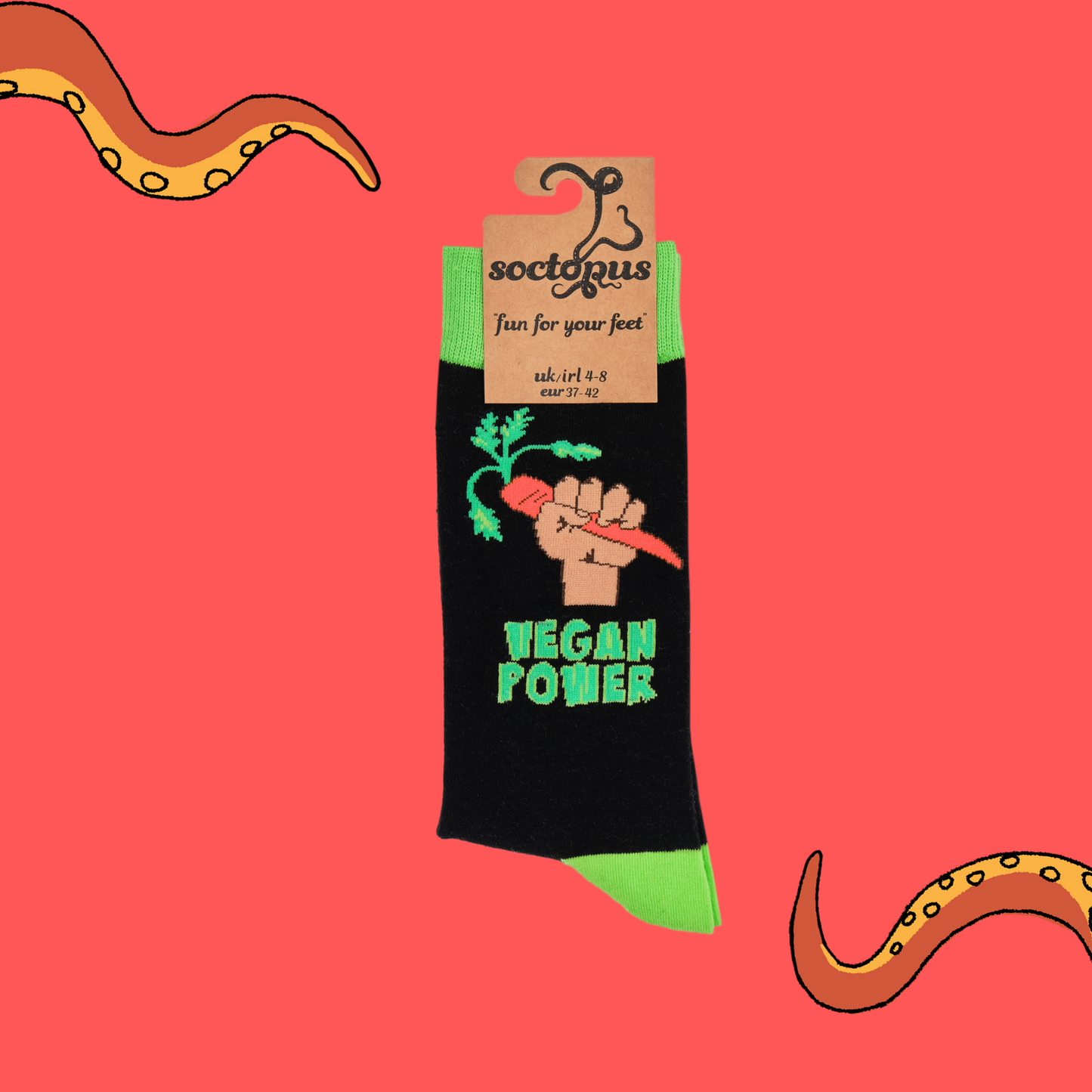 
                  
                    A pair of socks depicting a fist holding a carrot and the phrase 'Vegan Power'. Black legs, bright green cuff, heel and toe. In Soctopus Packaging.
                  
                