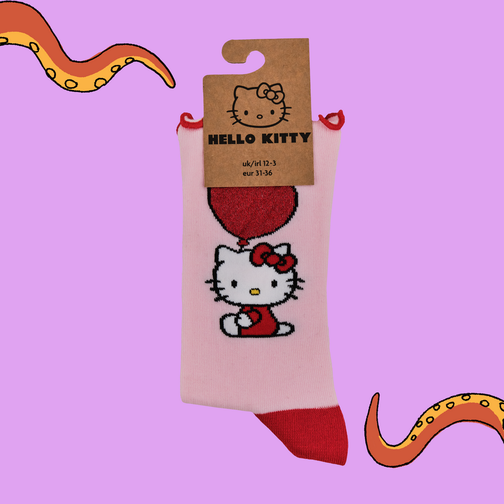 
                      
                        A pair of socks depicting Japanese icon Hello Kitty. Pink legs, read toe and heel with a frilly red cuff.
                      
                    