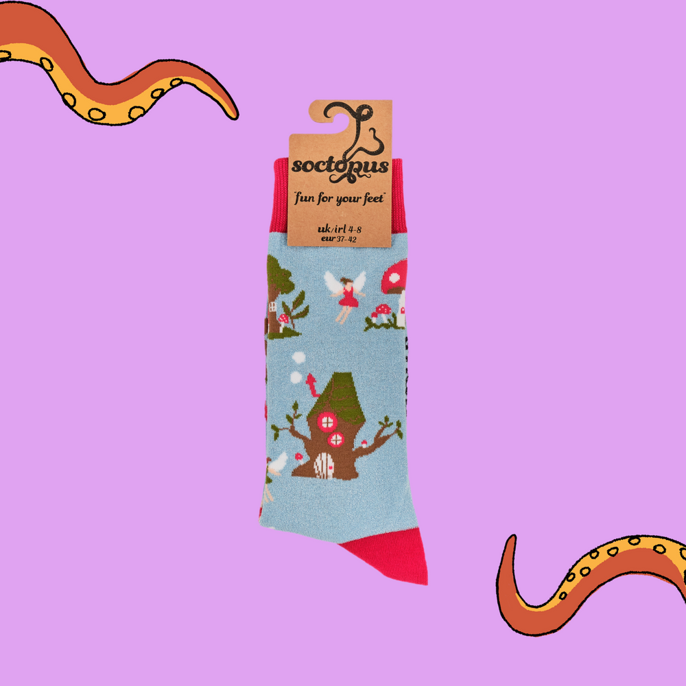 
                      
                         A pair of socks depicting fairies and toadstools. Light blue legs, red cuff, heel and toe. In Soctopus Packaging.
                      
                    