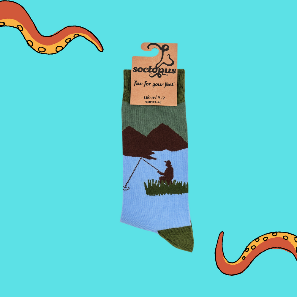 
                      
                        A pair of socks depicting fishermen on the water. Blue legs, green cuff, heel and toe. In Soctopus Packaging.
                      
                    