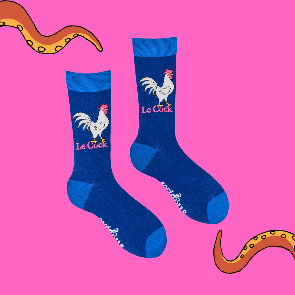 
                      
                        A pair of socks depicting a rooster whos in charge. Blue legs, light blue heel, toe and cuff. 
                      
                    