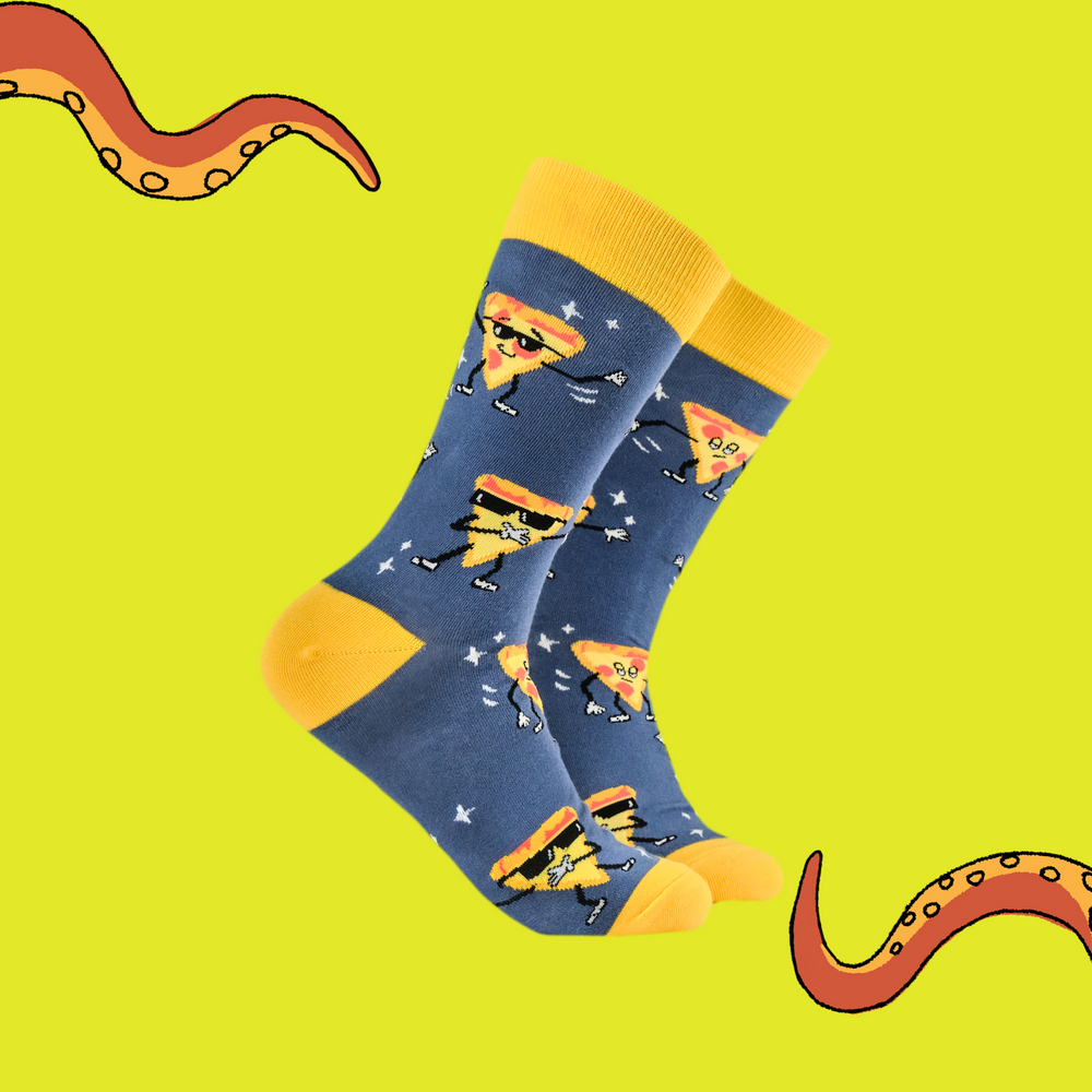 
                      
                        A pair of socks featuring a dancing slice of pizza. Blue legs, yellow heel toe and cuff. 
                      
                    