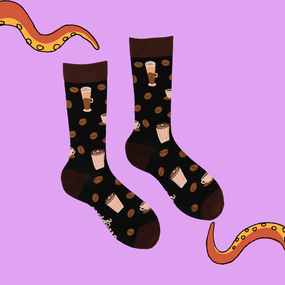 
                      
                        A pair of socks with a coffee motif. Dark brown legs, light brown heel, toe and cuff. 
                      
                    