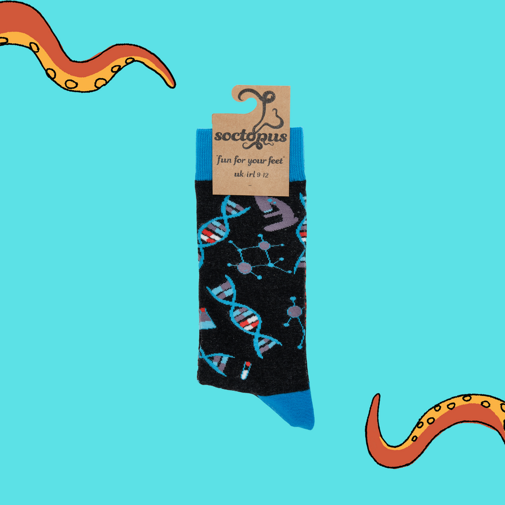 
                      
                        A pair of socks depicting DNA and microscopes. Black legs, light blue cuff, heel and toe. In Soctopus Packaging.
                      
                    