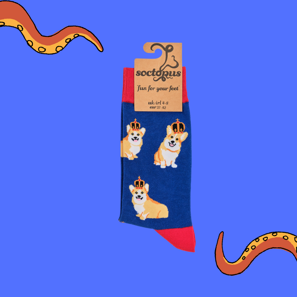 
                  
                    A pair of socks depicting corgis wearing crowns. Blue legs, red cuff, heel and toe. In Soctopus Packaging.
                  
                