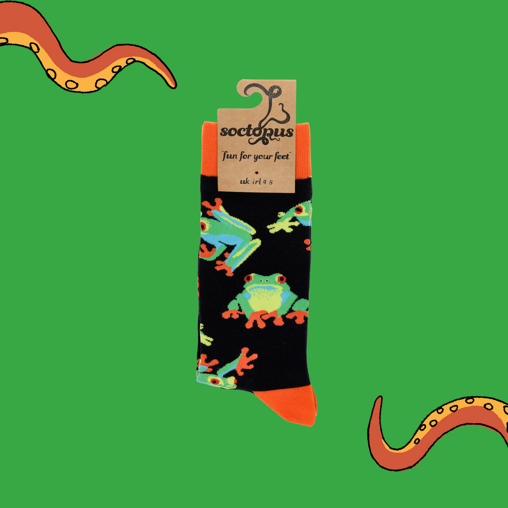 
                  
                    A pair of socks depicting tree frogs. Black legs, orange cuff, heel and toe. In Soctopus Packaging.
                  
                