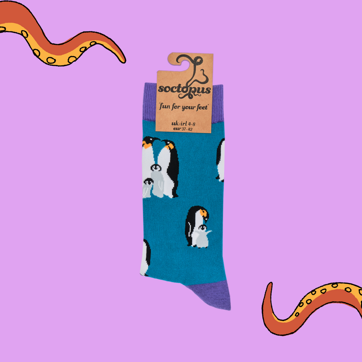 
                  
                    A pair of socks depicting a penguin family. Blue legs, purple cuff, heel and toe. In Soctopus Packaging.
                  
                