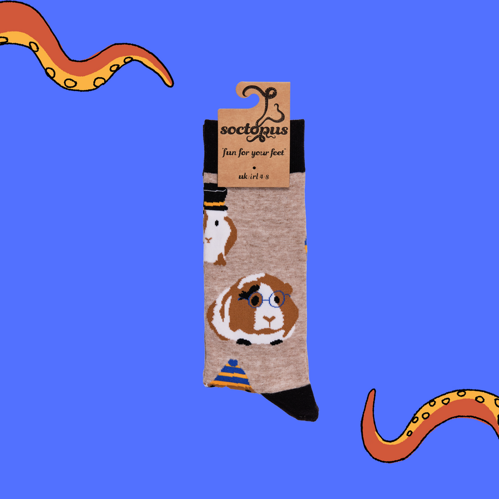 
                  
                    A pair of socks depicting Guinea Pigs dressed as toffs. Brown legs, black cuff, heel and toe. In Soctopus Packaging.
                  
                