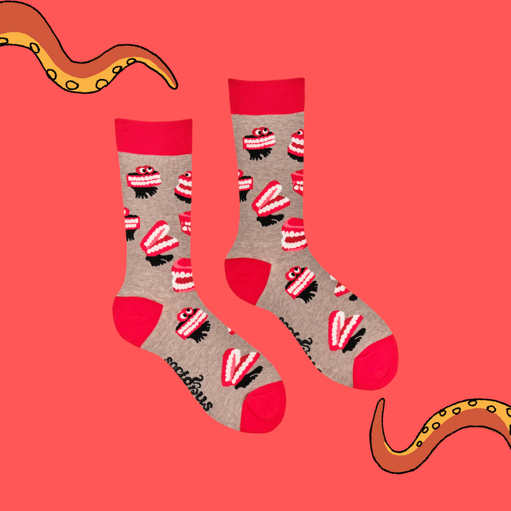 
                      
                        A pair of socks featuring wind up teeth. Brown legs, red heel, toe and cuff. 
                      
                    