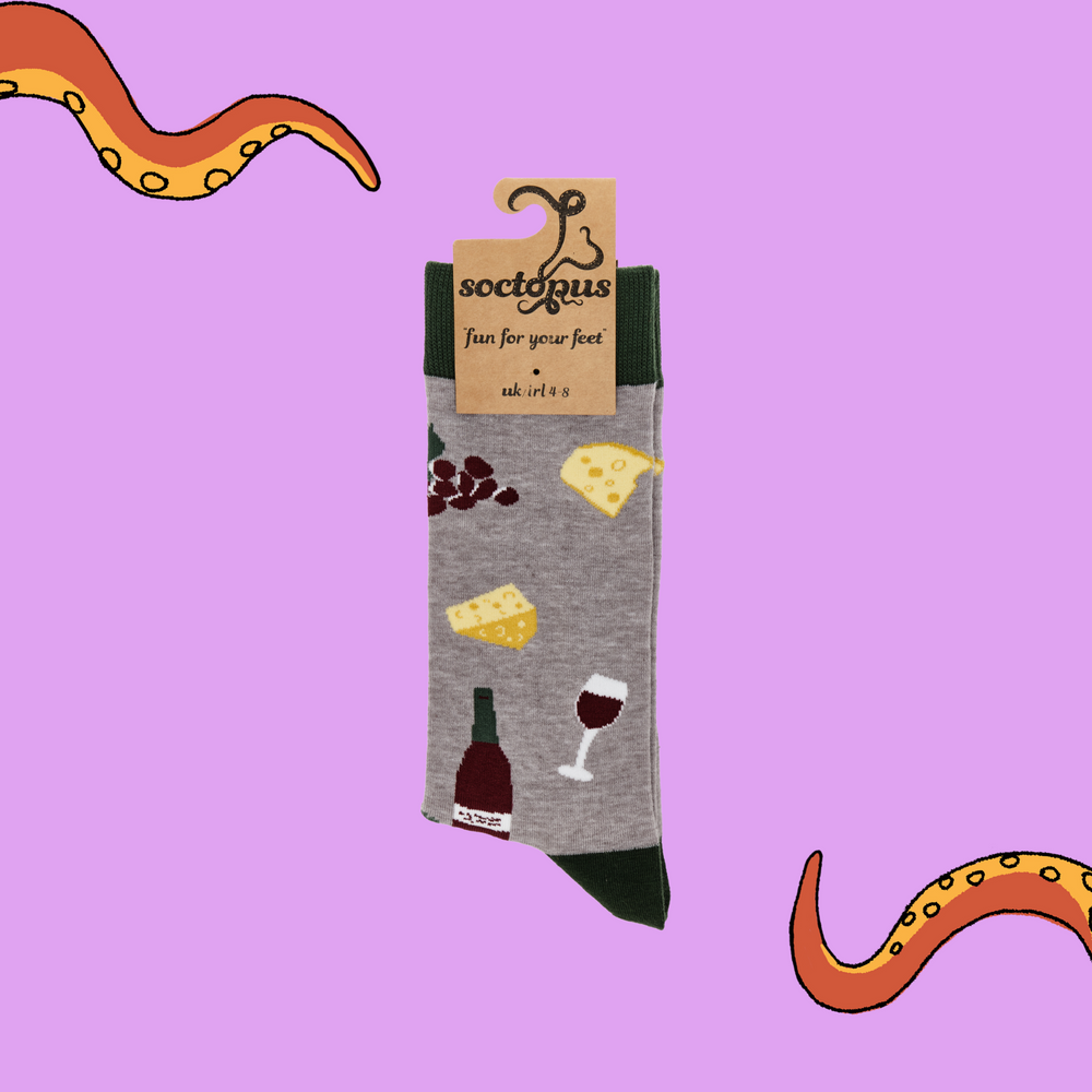 
                  
                    A pair of socks depicting wine, cheese and grapes. Grey legs, green cuff, heel and toe. In Soctopus Packaging.
                  
                