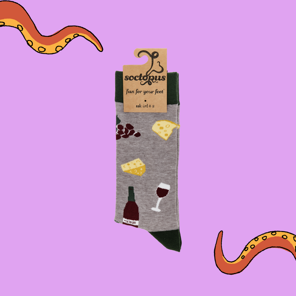 
                      
                        A pair of socks depicting wine, cheese and grapes. Grey legs, green cuff, heel and toe. In Soctopus Packaging.
                      
                    