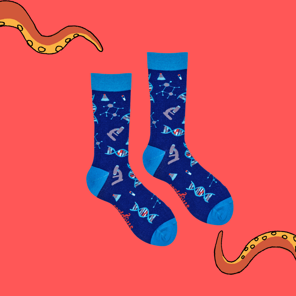 
                      
                        A pair of socks depicting DNA and microscopes. Blue legs, light blue cuff, heel and toe.
                      
                    