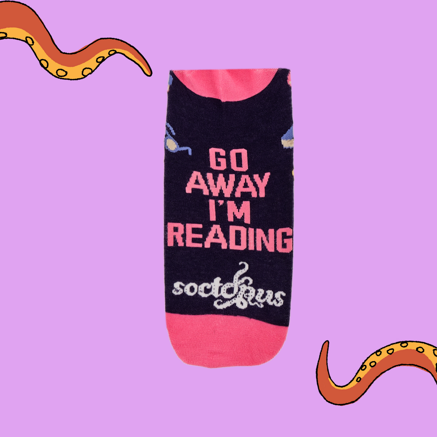 
                  
                    A pair of socks depicting books and reading glasses. Purple legs, pink cuff, heel and toe.
                  
                
