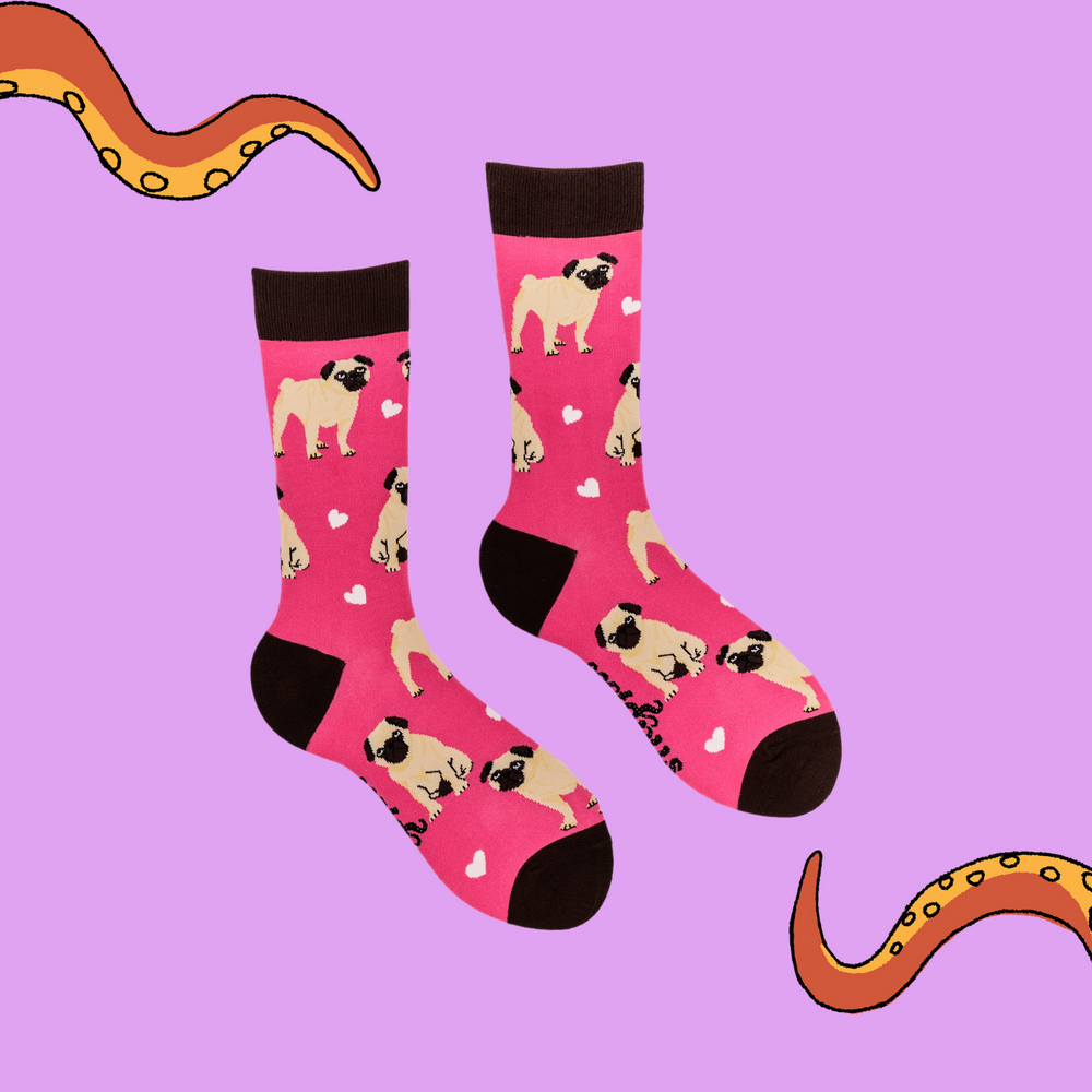 
                      
                        A pair of socks depicting hearts and pugs. Pink legs, brown cuff, heel and toe.
                      
                    