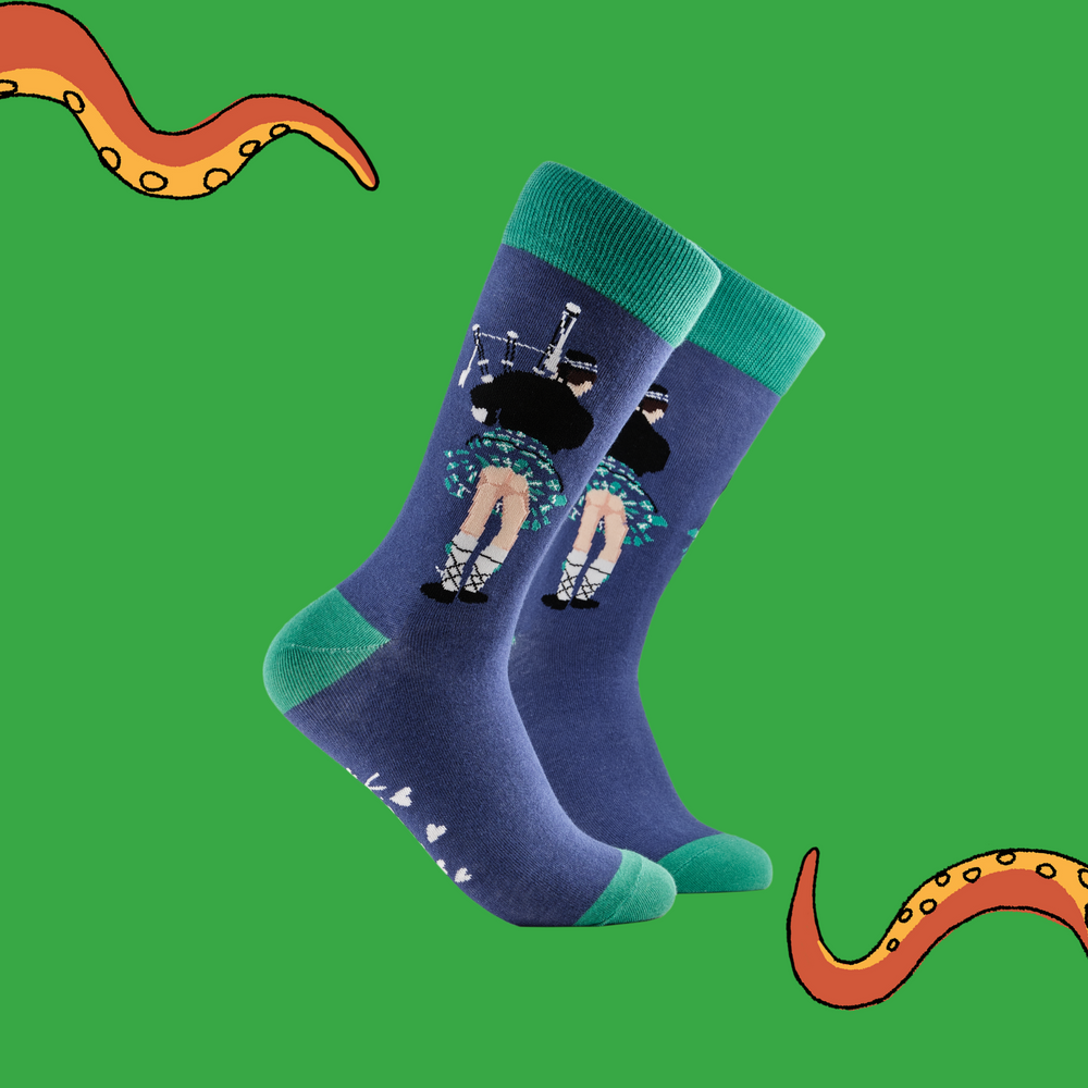 A pair of socks depicting whats really under a kilt. Purple legs, green cuff, heel and toe.