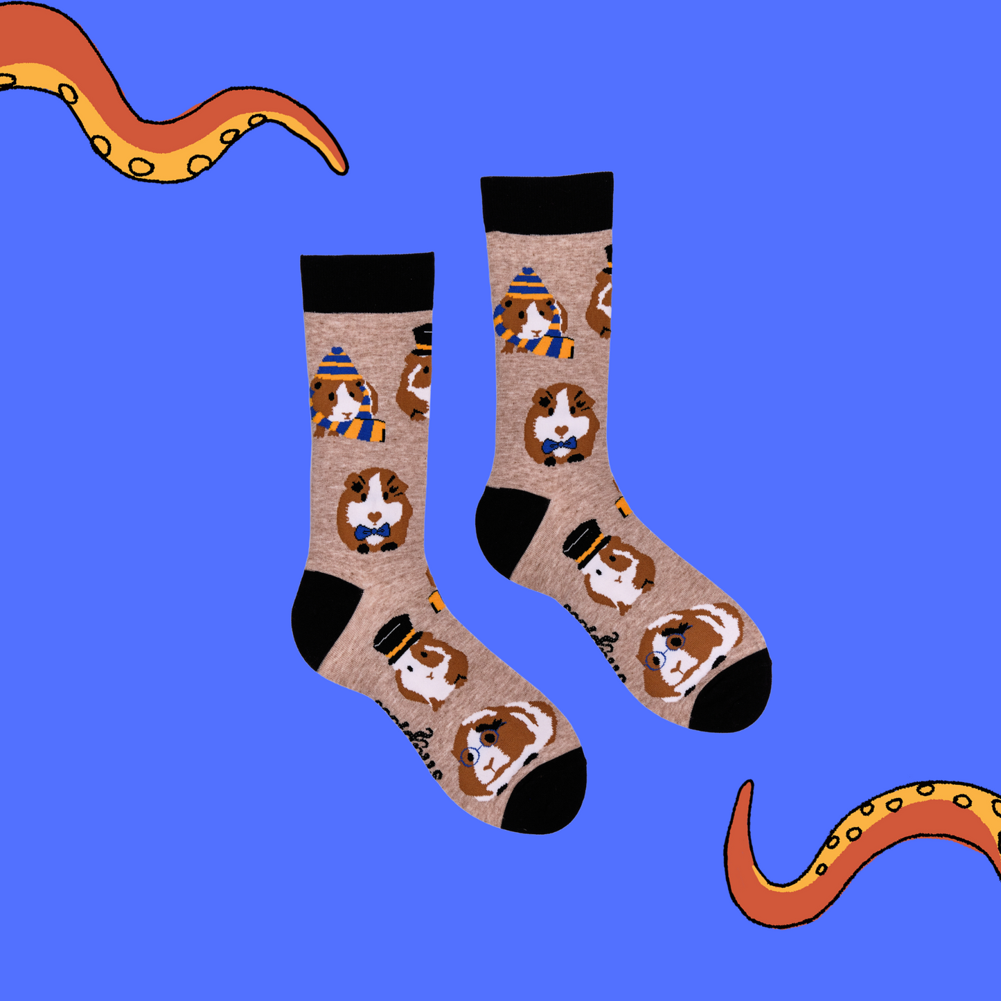 
                  
                    A pair of socks depicting Guinea Pigs dressed as toffs. Brown legs, black cuff, heel and toe.
                  
                