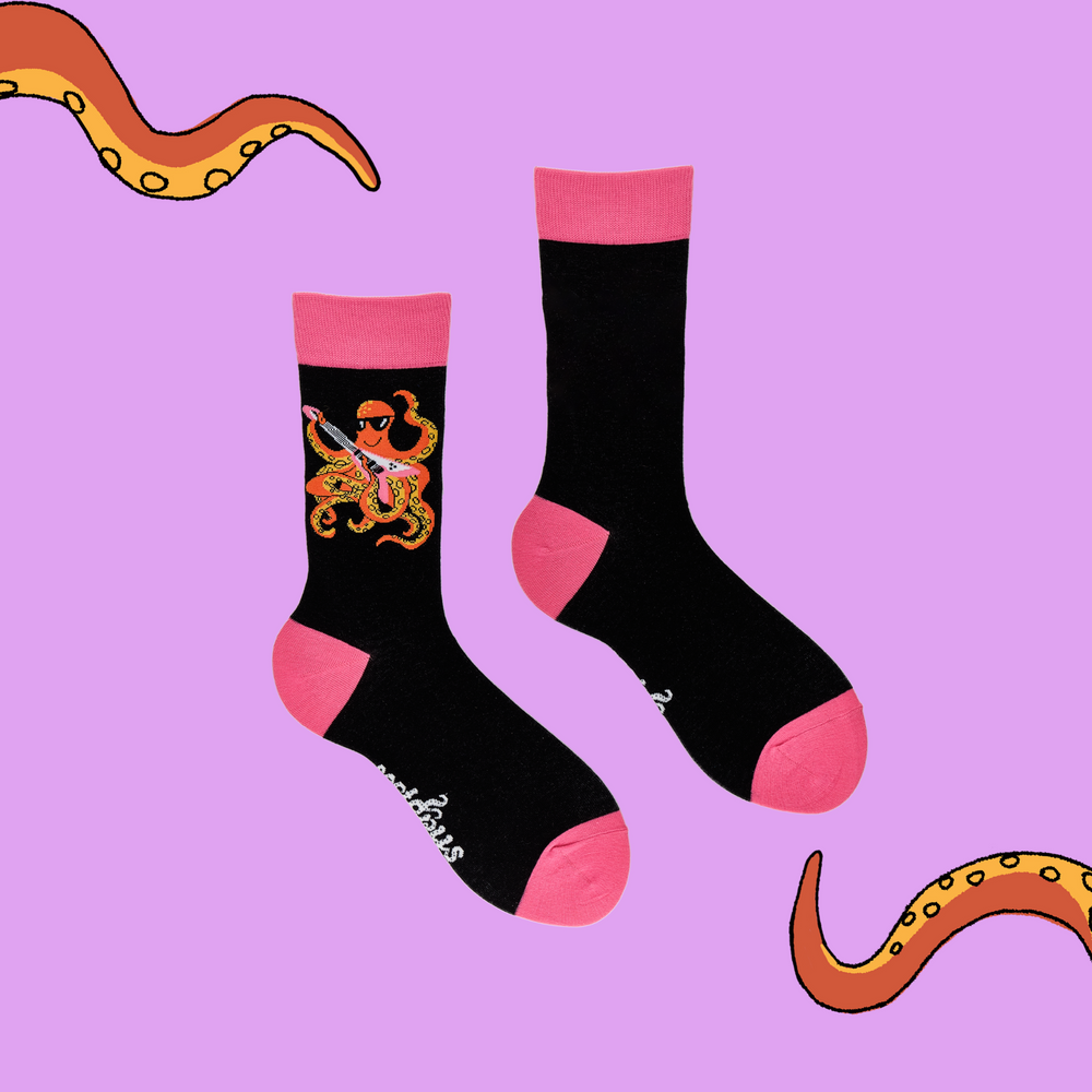 
                      
                        A pair of socks depicting an octopus playing a pink guitar. black legs, pink cuff, heel and toe.
                      
                    