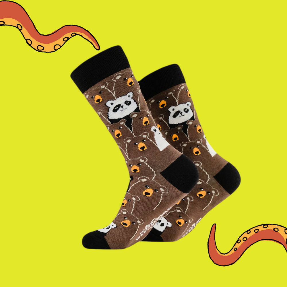 
                      
                        A pair of socks with a fun bear pattern. Brown legs, black heel, toe and cuff. 
                      
                    