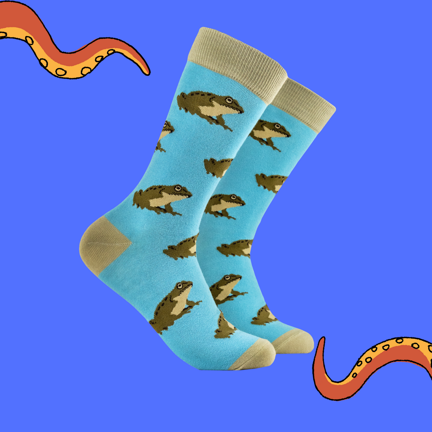 A pair of socks depicting frogs. Blue legs, brown heel, toe and cuff.  